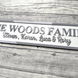 Load image into Gallery viewer, Family nameplate with 'The Woods Family' and names engraved on a wooden surface