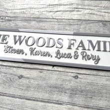 Load image into Gallery viewer, Family nameplate with 'The Woods Family' and names engraved on a wooden surface