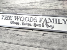 Load image into Gallery viewer, Family nameplate with 'The Woods Family' and names engraved on a wooden surface