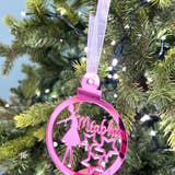 Load image into Gallery viewer, A custom-name Christmas tree decoration featuring a mirrored acrylic ballet dancer with a star, held against a blurred Christmas tree background. The decoration is in pink, with a name 'Mia' written on it.