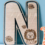 Load image into Gallery viewer, A wooden wall letter 'N' with jungle animals like a lion and giraffe illustrated on it, placed against a blue background.