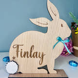 Load image into Gallery viewer, Personalised wooden Easter bunny decoration, engraved with custom name. Perfect for Easter gifts, baskets, and festive home decor