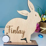 Load image into Gallery viewer, Personalised wooden Easter bunny decoration, engraved with custom name. Perfect for Easter gifts, baskets, and festive home decor