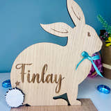 Load image into Gallery viewer, Personalised wooden Easter bunny decoration, engraved with custom name. Perfect for Easter gifts, baskets, and festive home decor