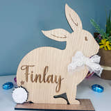 Load image into Gallery viewer, Personalised wooden Easter bunny decoration, engraved with custom name. Perfect for Easter gifts, baskets, and festive home decor
