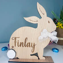 Load image into Gallery viewer, Personalised wooden Easter bunny decoration, engraved with custom name. Perfect for Easter gifts, baskets, and festive home decor