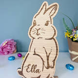 Load image into Gallery viewer, Personalised wooden Easter bunny decoration, engraved with custom name. Perfect for Easter gifts, baskets, and festive home decor