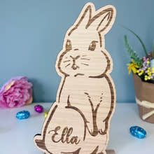 Load image into Gallery viewer, Personalised wooden Easter bunny decoration, engraved with custom name. Perfect for Easter gifts, baskets, and festive home decor