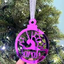 Load image into Gallery viewer, A pink circular Christmas tree decoration with a gymnast figure in the center, hanging on a Christmas tree.