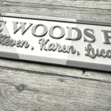 Load image into Gallery viewer, acrylic sign with 'The Woods Family' and names on a acrylic surface