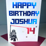 Load image into Gallery viewer, A personalized birthday card with the name Joshua and the age 14, featuring a graphic of Darth Vader and birthday cake candles.