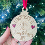 Load image into Gallery viewer, A personalized oak veneer Christmas decoration with the text 'Christmas is where.