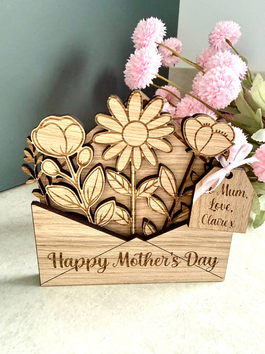 Personalised wooden Mothers day card with ‘Happy Mother’s day’ laser engraved on the front and a wooden gift tag with personalised gift details.