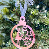 Load image into Gallery viewer, A round, red Christmas tree decoration with a silhouette of a ballet dancer in the center, with 'Kiera' and 'Zoe' names engraved on it. There is a pink ribbon-like hanging loop at the top.