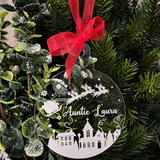 Load image into Gallery viewer, Personalised clear acrylic Christmas bauble with Santa, reindeer, snowy village, stars and the name Auntie Laura