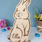 Load image into Gallery viewer, Personalised wooden Easter bunny decoration, engraved with custom name. Perfect for Easter gifts, baskets, and festive home decor