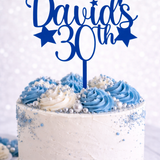Load image into Gallery viewer, Personalised blue acrylic birthday cake topper with custom name and age on white celebration cake with blue buttercream and silver decorations.