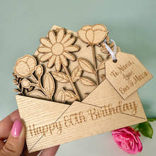 Load image into Gallery viewer, Wooden card with floral design and 'Happy 80th Birthday' text, held by a hand.