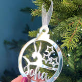 Load image into Gallery viewer, A pink circular Christmas tree decoration with a gymnast figure in the center, hanging on a Christmas tree.