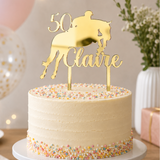 Load image into Gallery viewer, Personalised mirrored gold horse and rider birthday cake topper with custom name and age on a birthday cake.