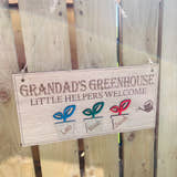 Load image into Gallery viewer, Wooden grandard greenhouse sign hanging against a garden fence with twine and 3 plants pots with childrensnames