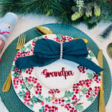 Load image into Gallery viewer, Christmas dinner table setting with personalised acrylic place name ‘Grandpa’ in red, festive plate and green napkin