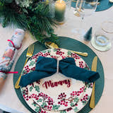 Load image into Gallery viewer, Christmas dinner table setting with personalised acrylic place name ‘Mummy’ in red, festive plate and green napkin
