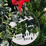 Load image into Gallery viewer, Personalised Christmas bauble with Santa and reindeer, snowy village, stars and name Luca on clear acrylic