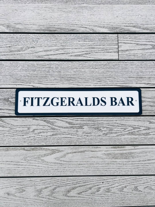 Personalised bar name sign mounted on outdoor wall, perfect for home bar, man cave, or garden pub decor