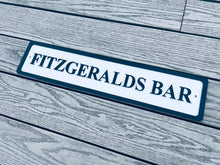Load image into Gallery viewer, Personalised bar name sign mounted on outdoor wall, perfect for home bar, man cave, or garden pub decor