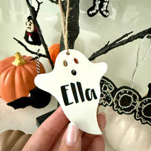 Load image into Gallery viewer, Personalised ghost Halloween tree decoration with engraved name hanging on a Halloween tree with pumpkins and spooky ornaments.