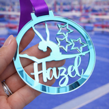 Load image into Gallery viewer, blue mirror acrylic personalised gymnastics medal held in hand with custom name design