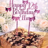 Load image into Gallery viewer, Pink mirrored acrylic personalised cake topper reading “Happy 12th Birthday Ella” displayed on a chocolate brownie celebration cake topped with assorted chocolates against a soft floral background.