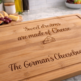 Load image into Gallery viewer, Wooden cheeseboard with engraved text on a kitchen counter.
