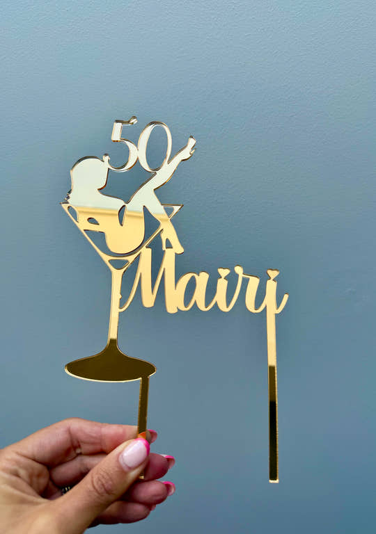 Personalised cocktail birthday cake topper displayed on a celebration cake for a milestone birthday.