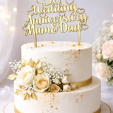 Load image into Gallery viewer, Gold mirror acrylic 50th Wedding Anniversary cake topper in elegant script on a white buttercream wedding cake decorated with cream roses.