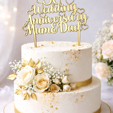 Load image into Gallery viewer, Gold mirror acrylic 50th Wedding Anniversary cake topper in elegant script on a white buttercream wedding cake decorated with cream roses.