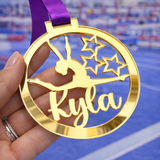 Load image into Gallery viewer, gold mirror acrylic personalised gymnastics medal held in hand with custom name design