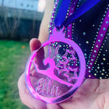 Load image into Gallery viewer, Hand holding a purple personalised gymnast medal, showing its size