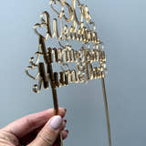 Load image into Gallery viewer, Side view of the gold mirror golden wedding cake topper catching the light