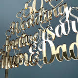 Load image into Gallery viewer, Close-up of the script lettering and hearts on the gold 50th Wedding Anniversary cake topper