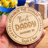 Load image into Gallery viewer, Close up personalised best daddy medal engraved wood fathers day gift UK with blue ribbon