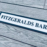 Load image into Gallery viewer, Personalised bar name sign mounted on outdoor wall, perfect for home bar, man cave, or garden pub decor