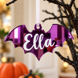Load image into Gallery viewer, Personalised bat Halloween tree decoration in purple mirrored acrylic with the name in white