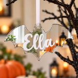 Load image into Gallery viewer, Personalised bat Halloween tree decoration in silver mirrored acrylic with the name in white