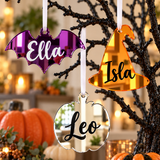 Load image into Gallery viewer, Personalised Halloween tree decorations: a purple bat, orange witch hat and silver pumpkin on a Halloween tree