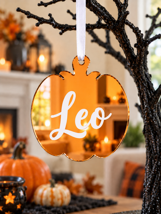 Personalised pumpkin Halloween tree decoration in orange mirrored acrylic with the name in white