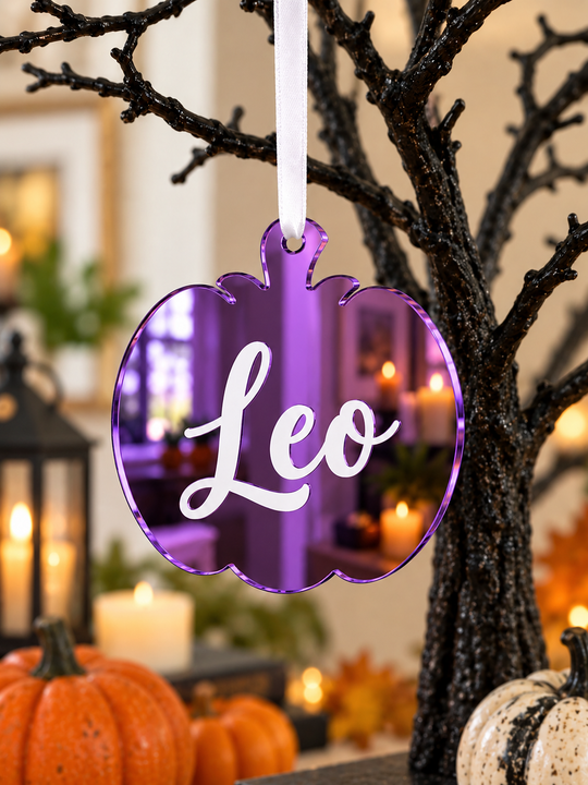 Personalised pumpkin Halloween tree decoration in purple mirrored acrylic with the name in white