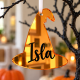 Load image into Gallery viewer, Personalised witch hat Halloween tree decoration in orange mirrored acrylic with the name in black