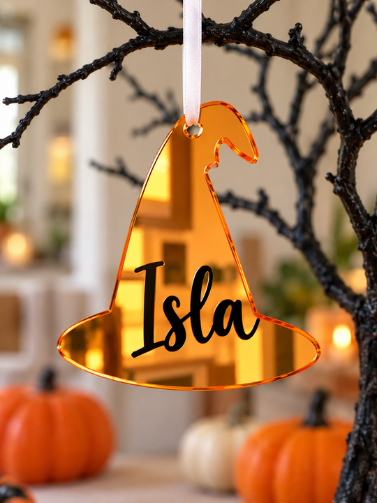 Personalised witch hat Halloween tree decoration in orange mirrored acrylic with the name in black
